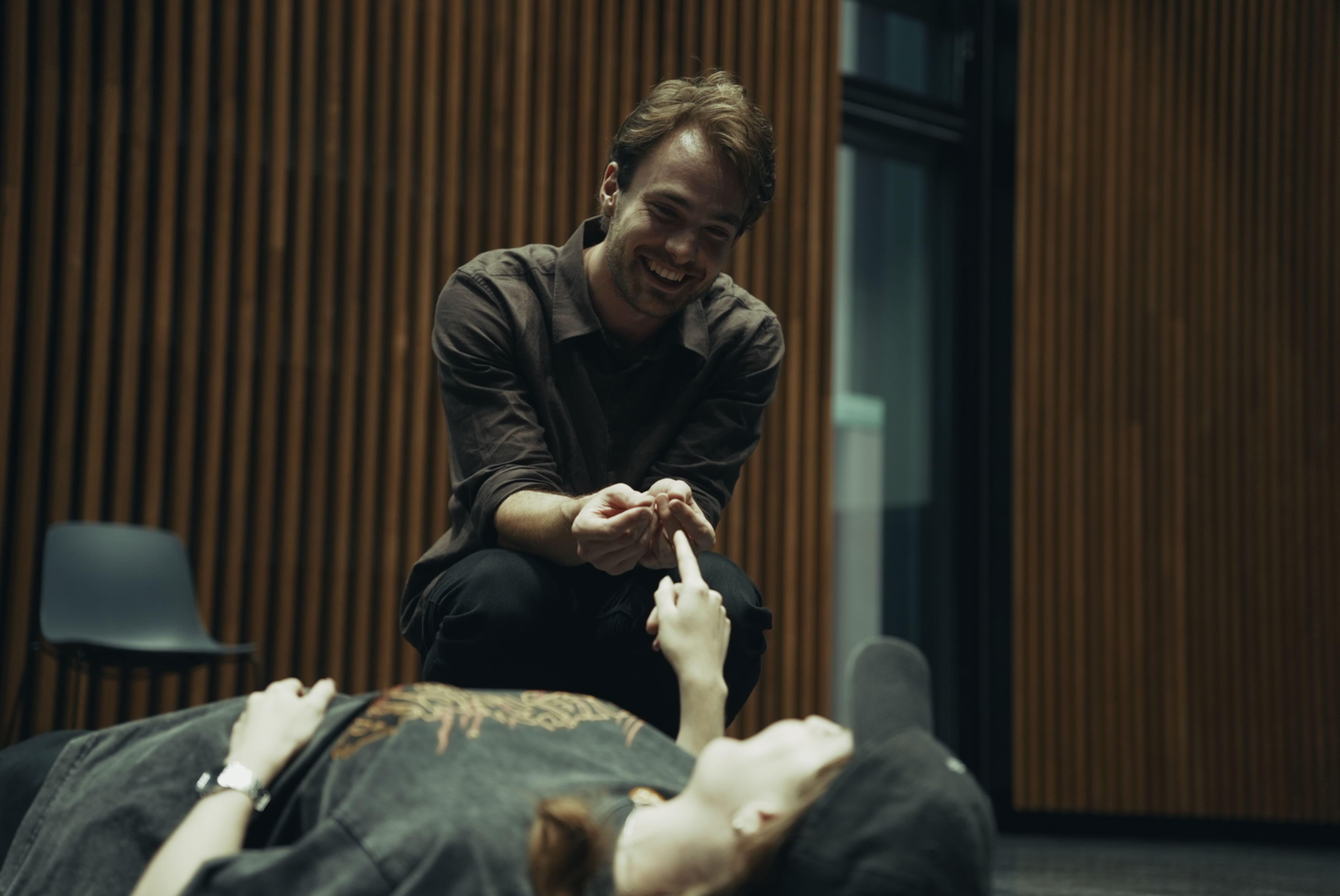 Actor listening during class.